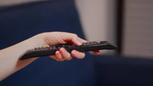 hand holding a remote control